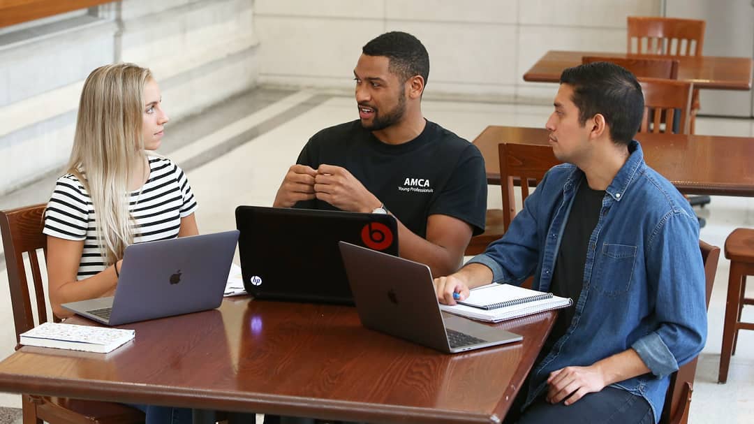 three people chatting
