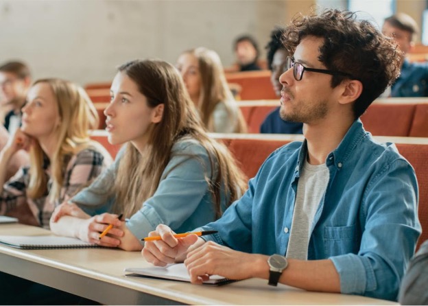 Sitting in a lecture.