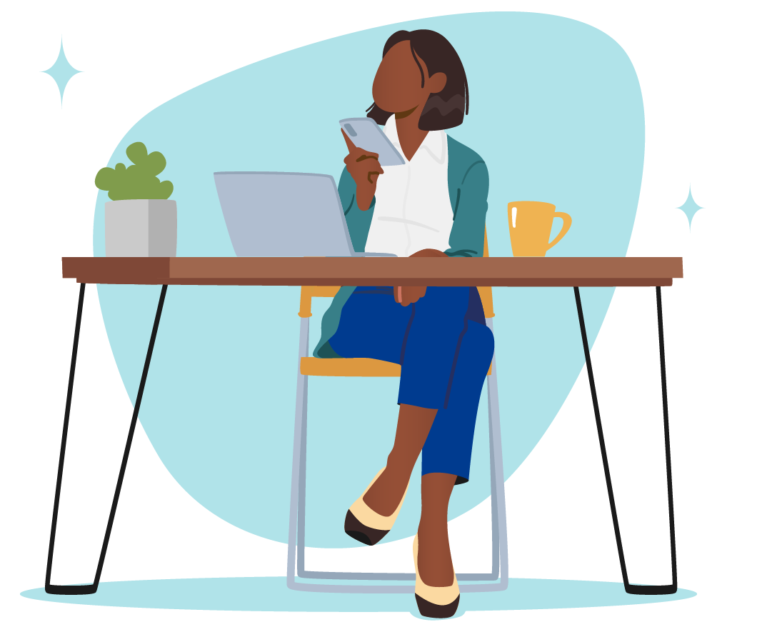 Woman on her phone in front of a laptop